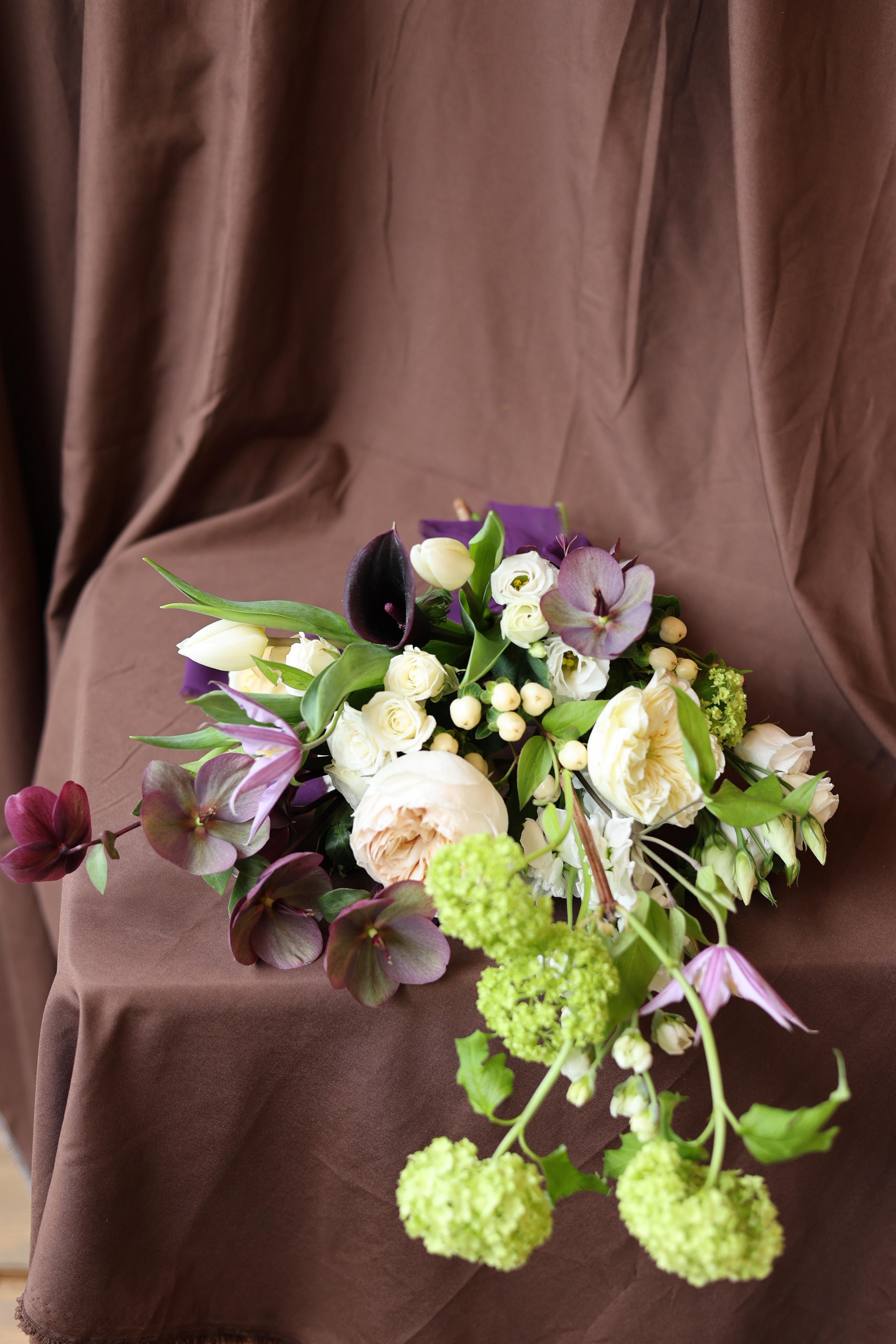 Bouquet of flowers on a brown fabric background